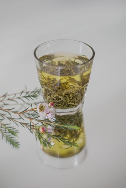 clear drinking glass with yellow liquid