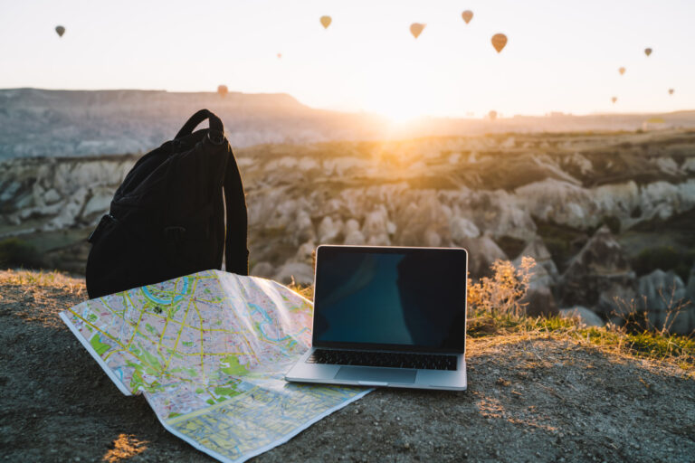backpack-map-and-computer-overlook-cappadocia-la-2026-03-24-22-44-34-utc